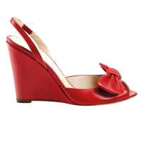 Zeppe in pelle con fiocco staccabile